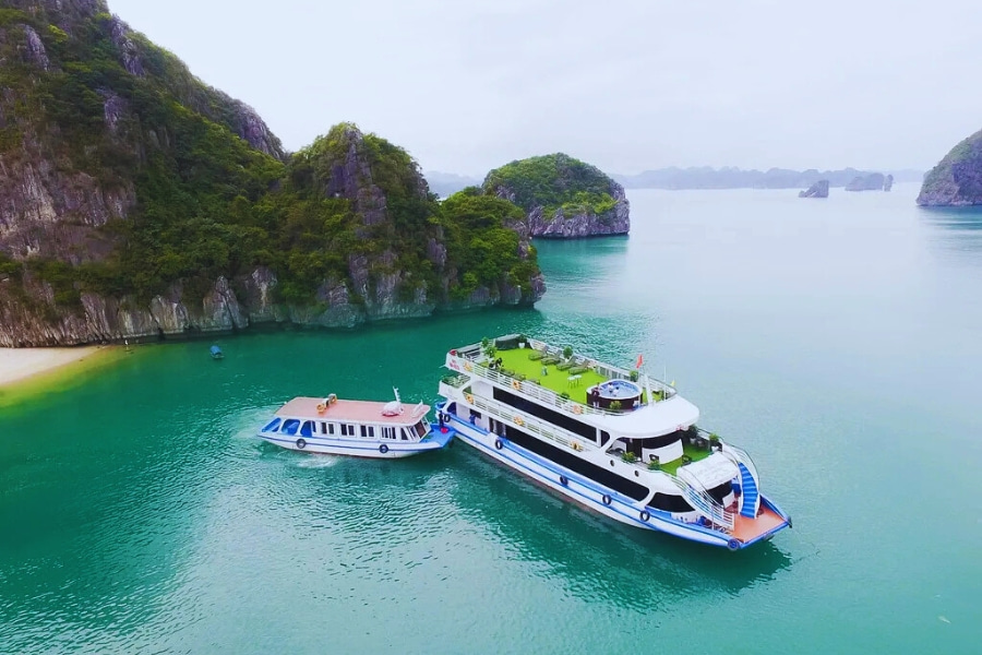 Luxury day cruise anchored in turquoise waters on Halong Bay Day Cruises Auasia Travel